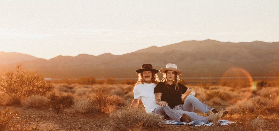 Couple in Hats in Desert